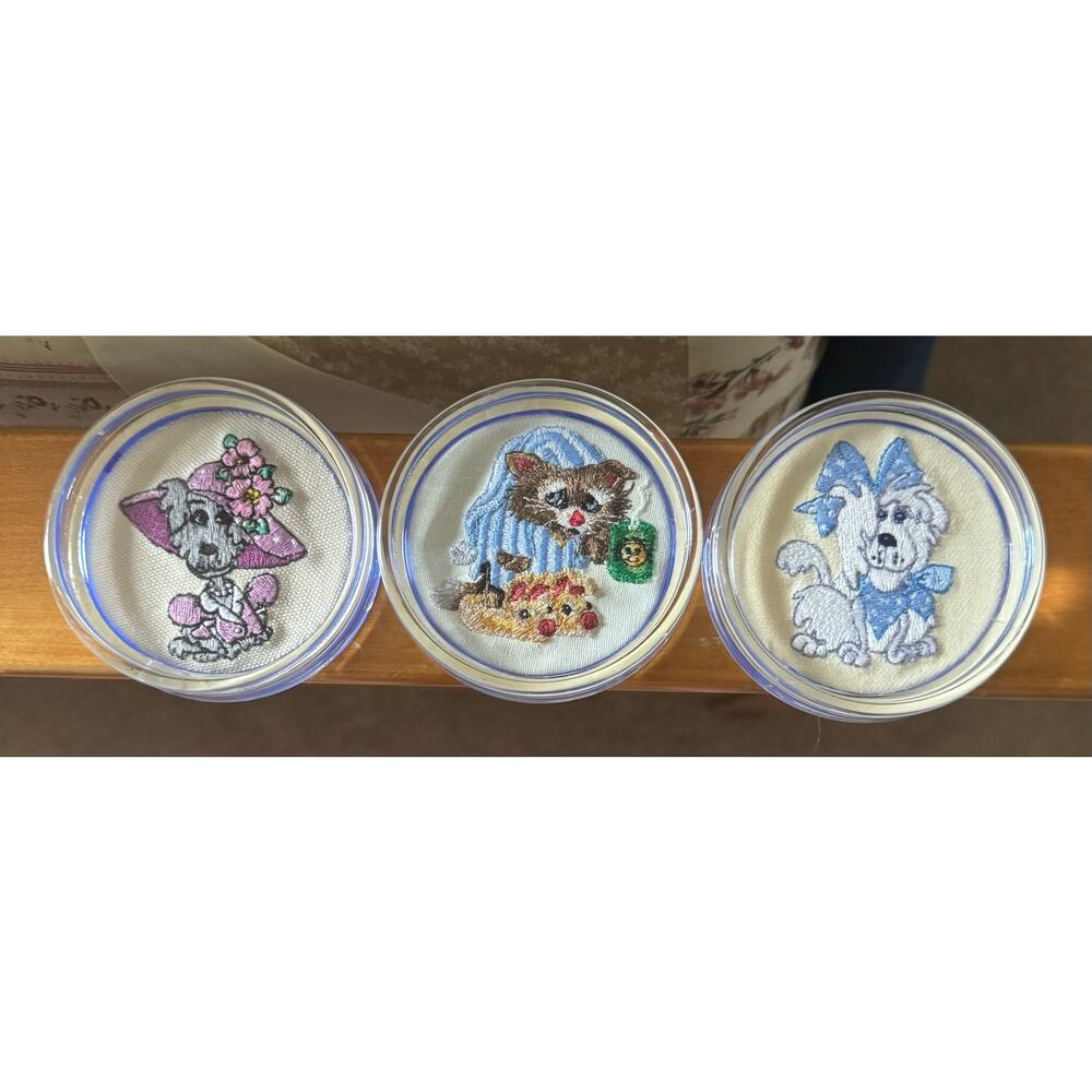 Set of three needlepoint plastic cup coasters - dogs and raccoon coffee